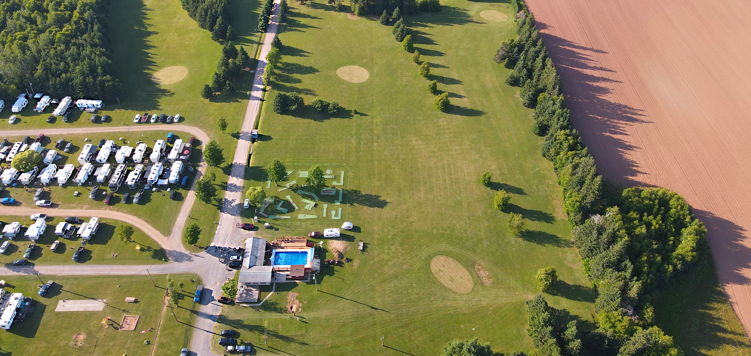 Aerial view of Seal Cove Campground & Golf Course, RV sites, pool, mini-golf and fairways
