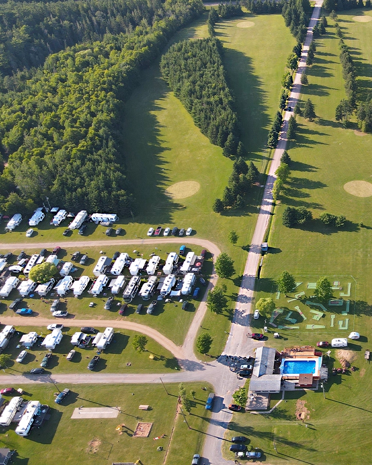 Aerial view of Seal Cove's RV sites, golf fairways, pool and mini-golf