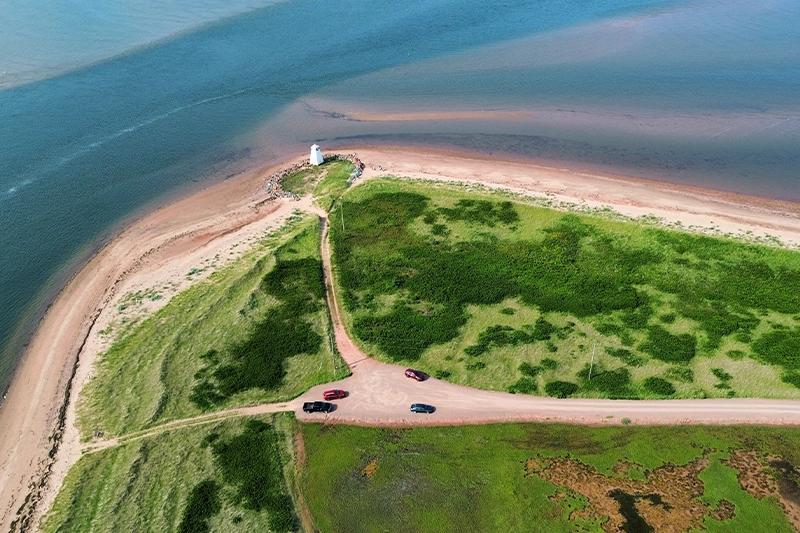 Sandy dune beach with a small beacon along the Northumberland shore