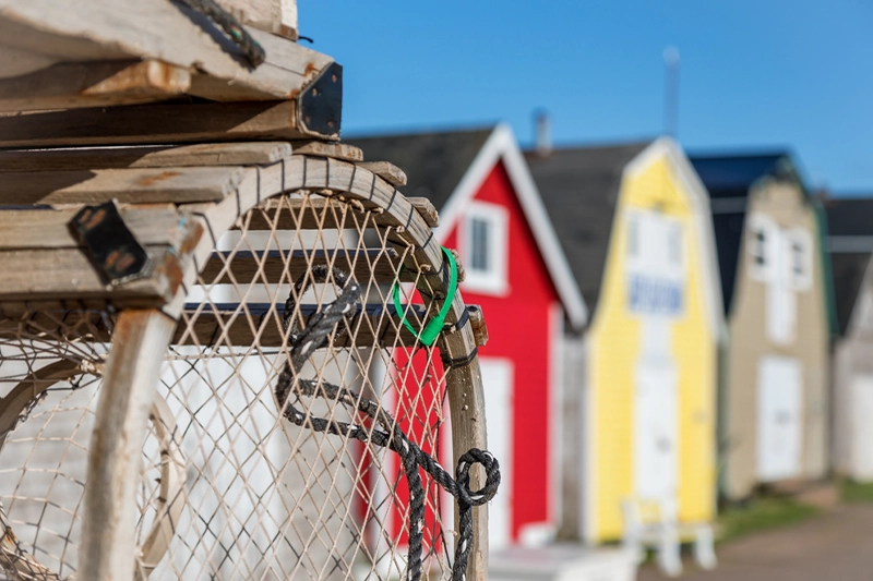 Lobster traps and colourful fishing shanties at a PEI wharf